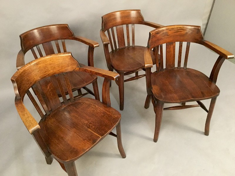 A Set of Four Captains Chairs
