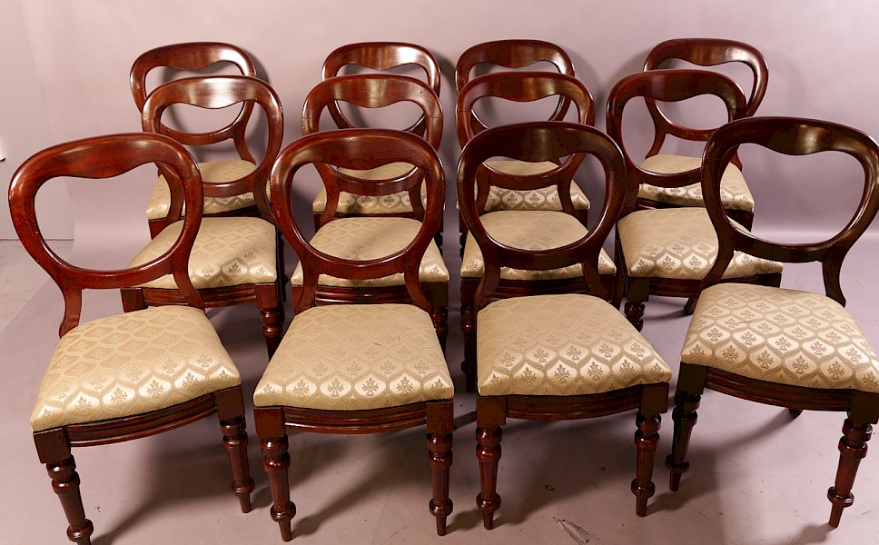 A Set of 12 Victorian Mahogany Balloon Back Dining Chairs