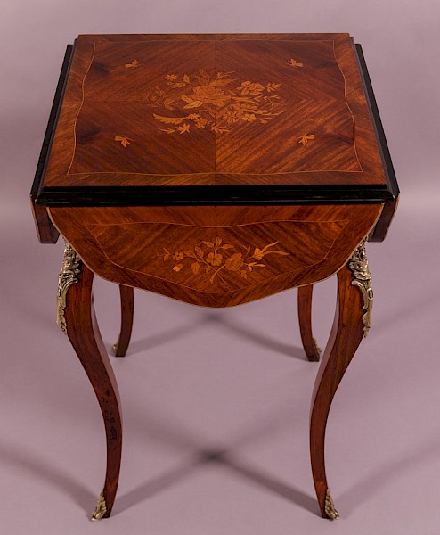 A French Kingwood Table with Marquerty inlay