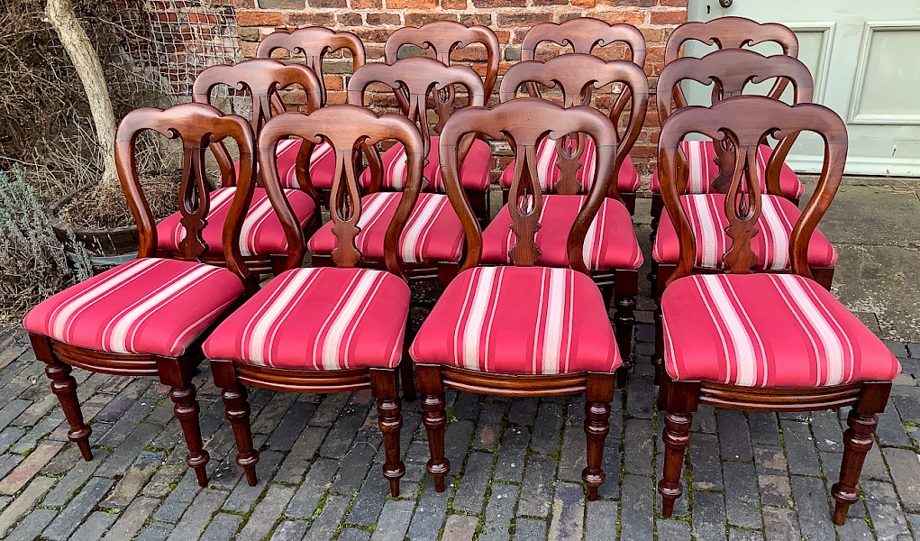 A Set of 12 Victorian Mahogany Spear Point Balloon Back dining Chairs