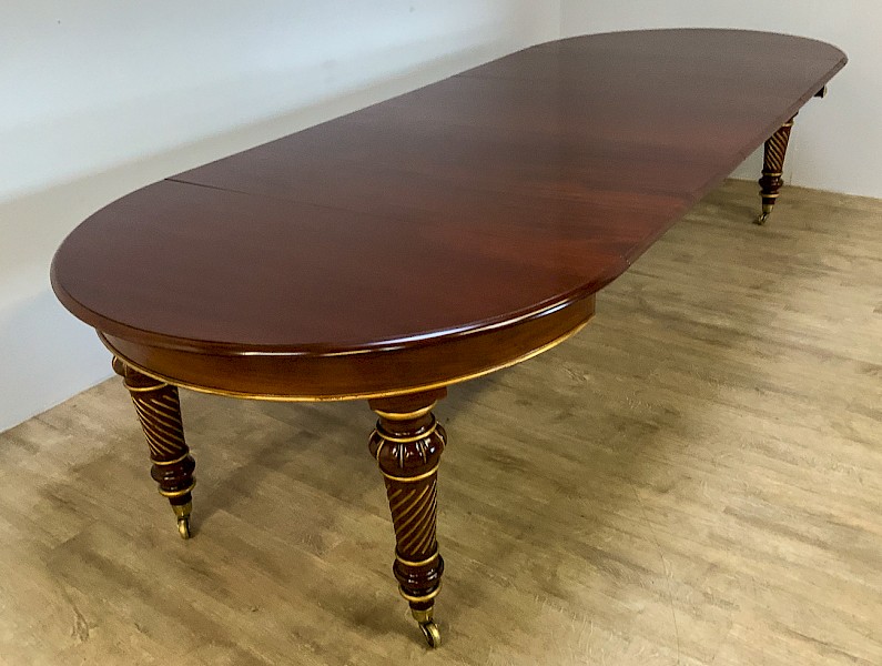 A Victorian Mahogany Dining Table with 3 leaves parcel gilt Harrods