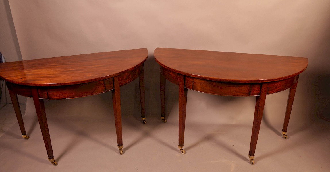 A pair of 18th century Demi Lune hall tables