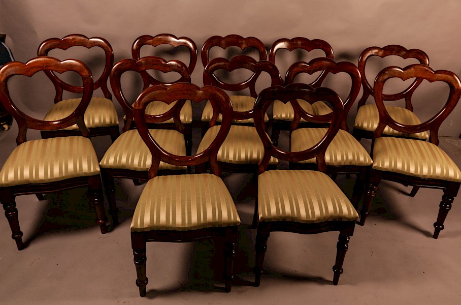 A Good Set of 12 Victorian Mahogany Balloon Back Dining Chairs