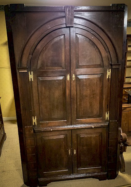 An 18th century full height Corner Cupboard in Oak