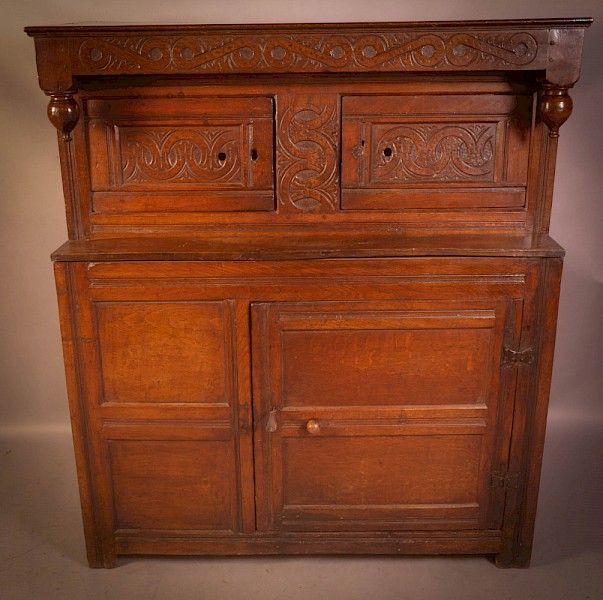A Small 17th century Cupboard in Oak original carving